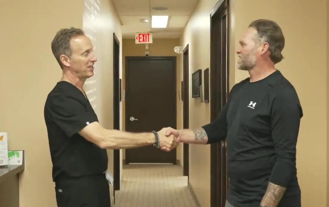 Dr. Pulver welcoming a patient to the office